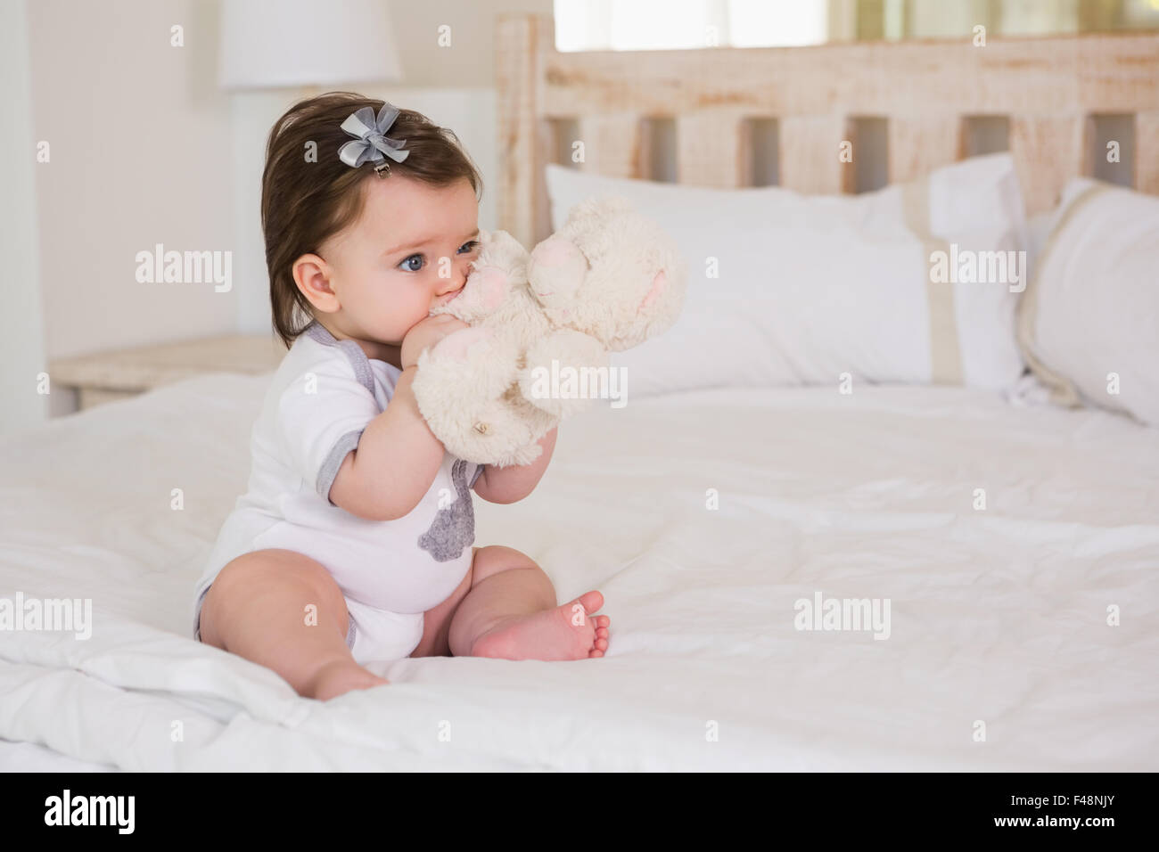 Beautiful cute baby girl with her teddy bear Stock Photo - Alamy