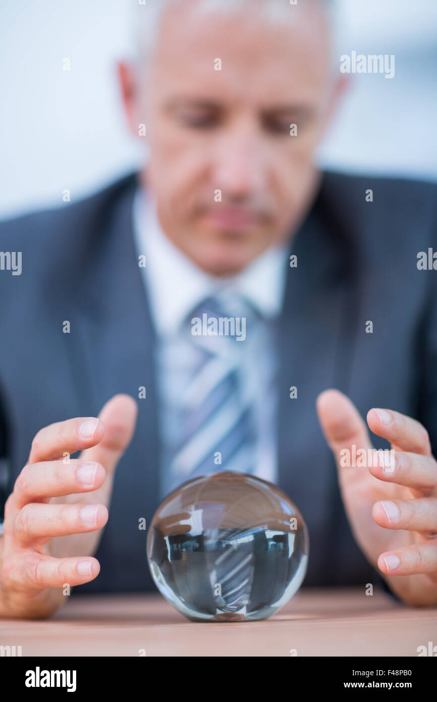 Businessman forecasting a crystal ball Stock Photo - Alamy