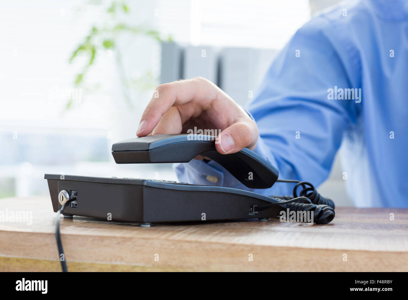 Businessman answer the phone Stock Photo