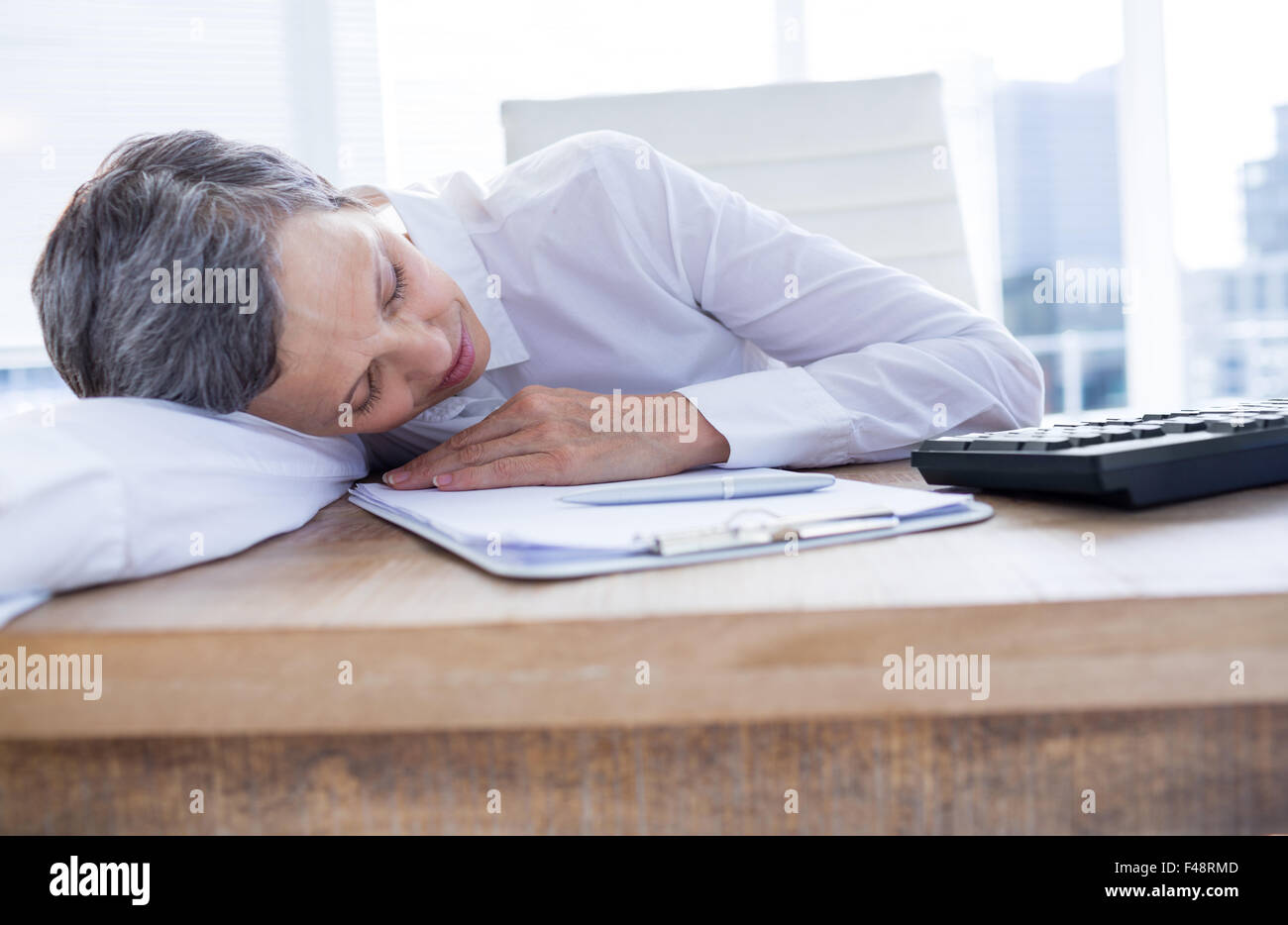 Tired businesswoman sleeping at her desk Stock Photo - Alamy