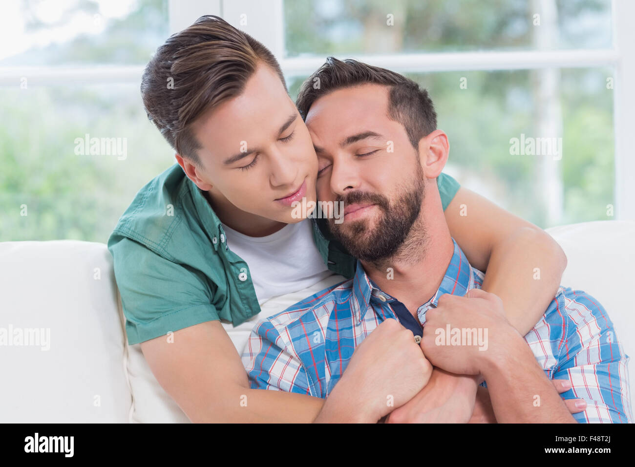Homosexual couple men hugging each other Stock Photo