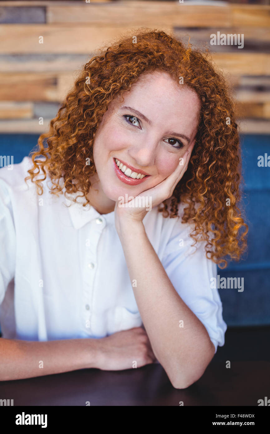 Young woman smiling at camera Stock Photo - Alamy