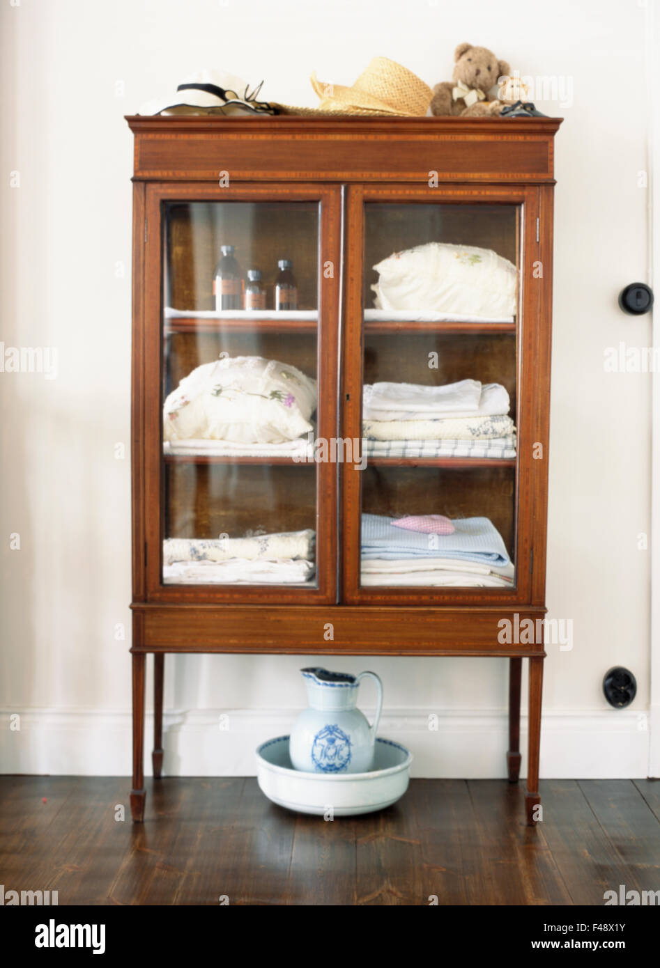 Glass front 2024 linen cabinet