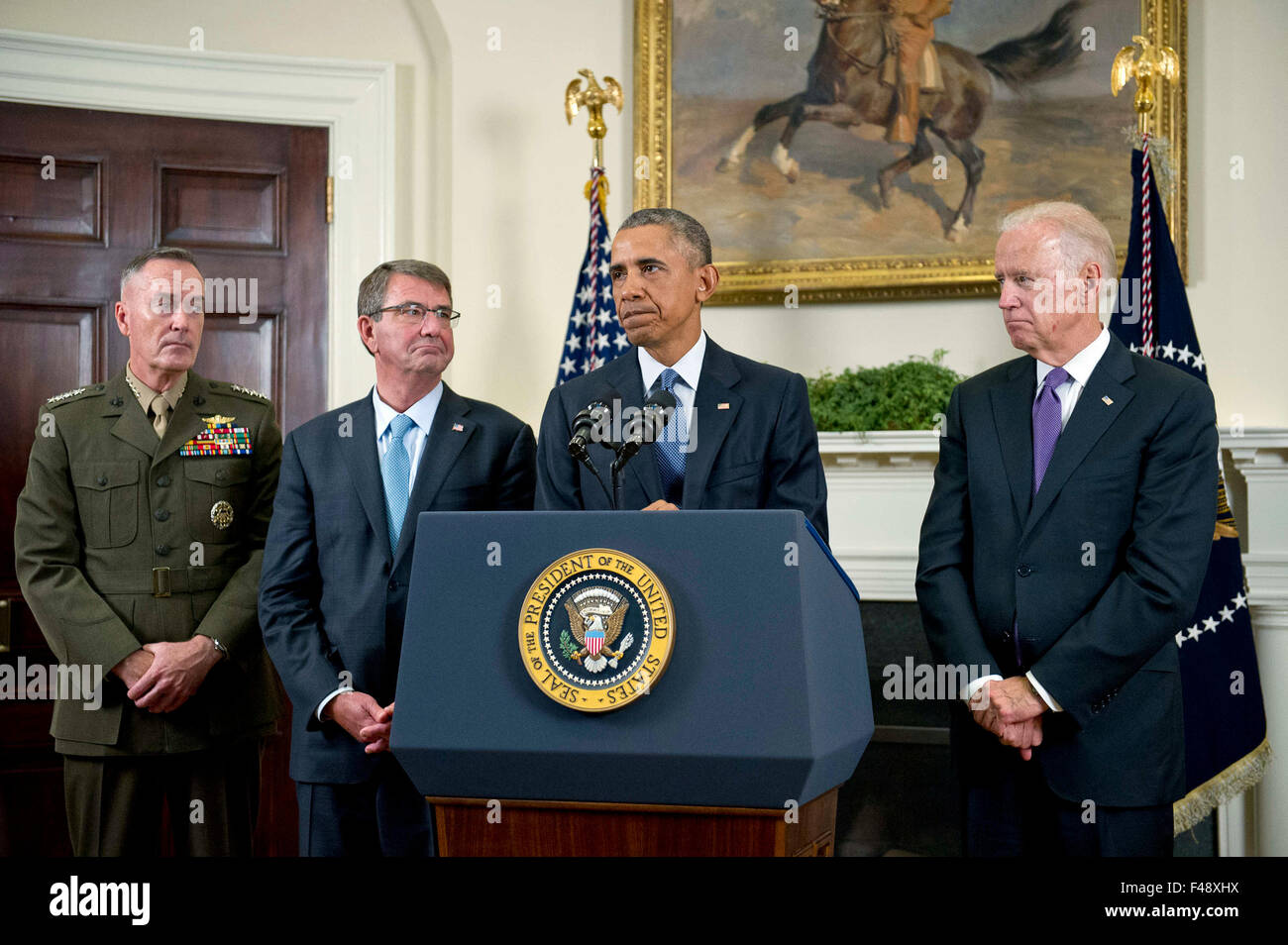 United States President Barack Obama announces he will keep 5,500 US troops in Afghanistan when he leaves office in 2017 and explains his reasoning for that action in the Roosevelt Room of the White House in Washington, DC on Thursday, October 15, 2015. From left to right: US Marine Corps General Joseph F. Dunford, Chairman, Joint Chiefs of Staff; US Secretary of Defense Ashton Carter; the President, and US Vice President Joe Biden. Credit: Ron Sachs/Pool via CNP - NO WIRE SERVICE - Stock Photo