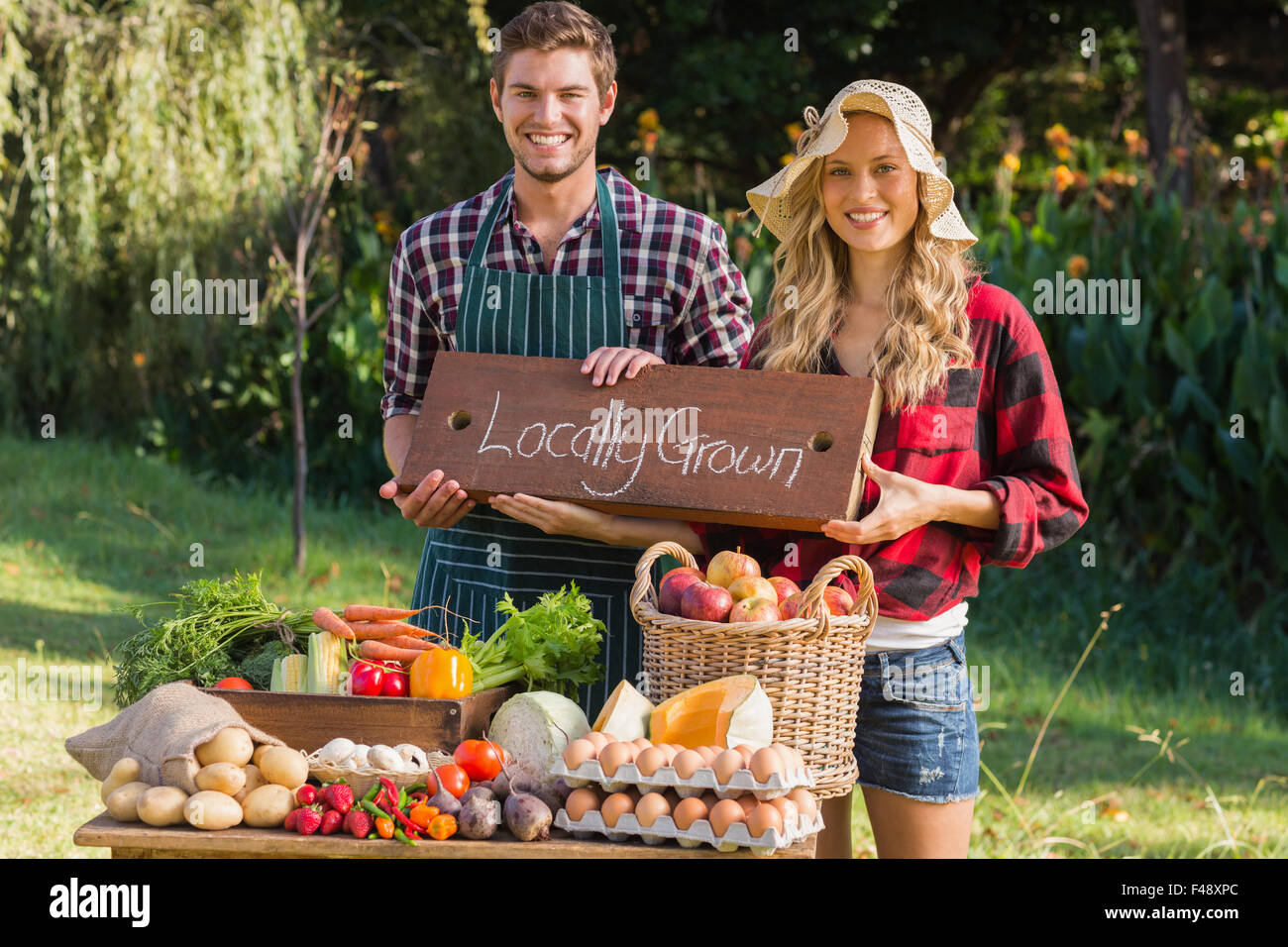 Young man selling vegetables hi-res stock photography and images - Alamy