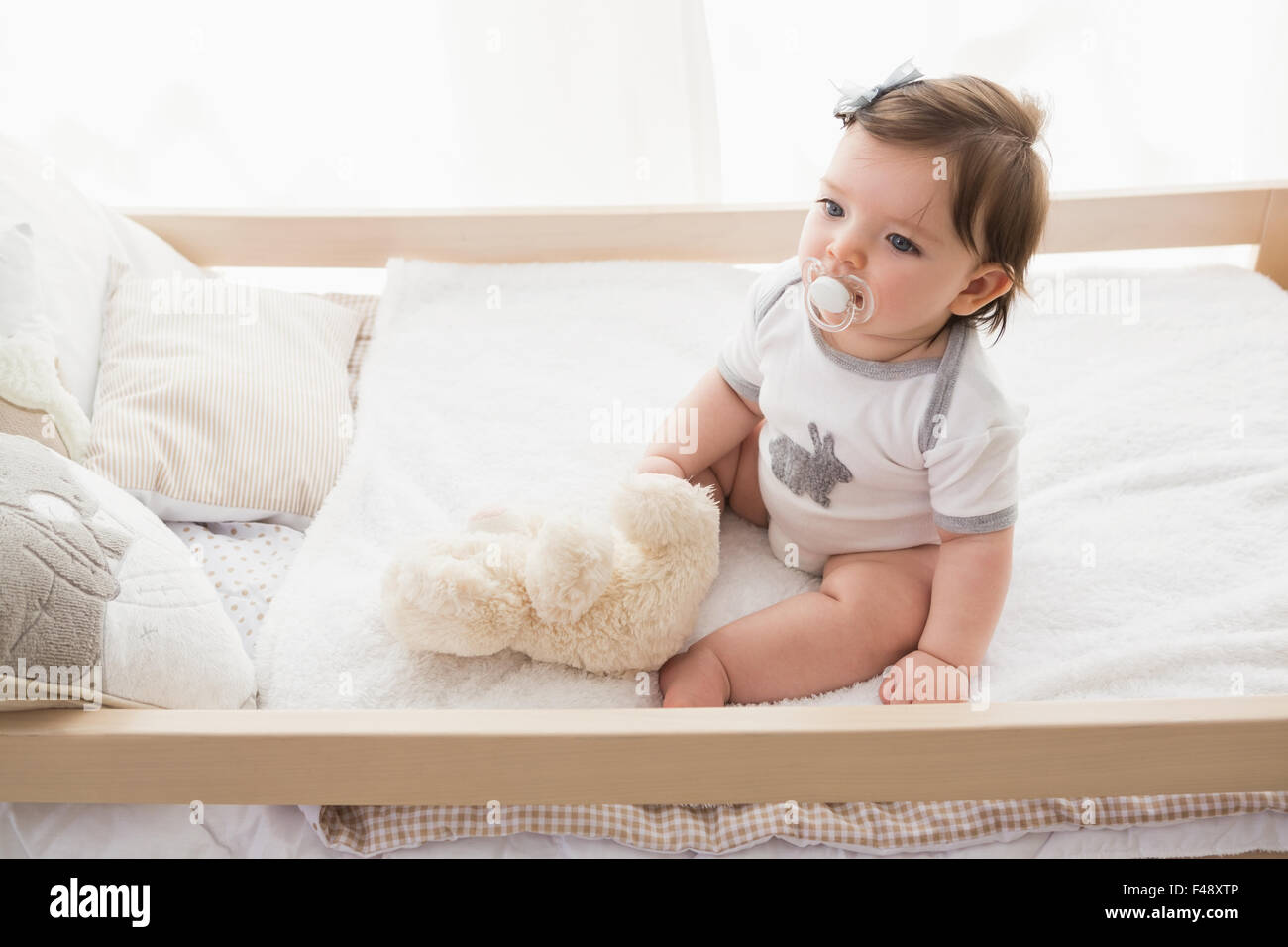 Beautiful cute baby girl with her teddy bear Stock Photo - Alamy
