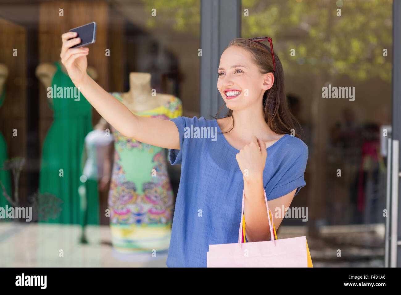 Happy woman taking a selfie Stock Photo - Alamy