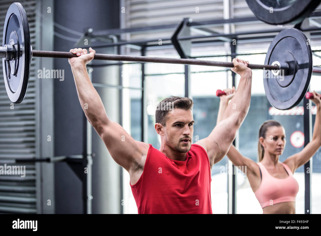 Two young Bodybuilders doing weightlifting Stock Photo