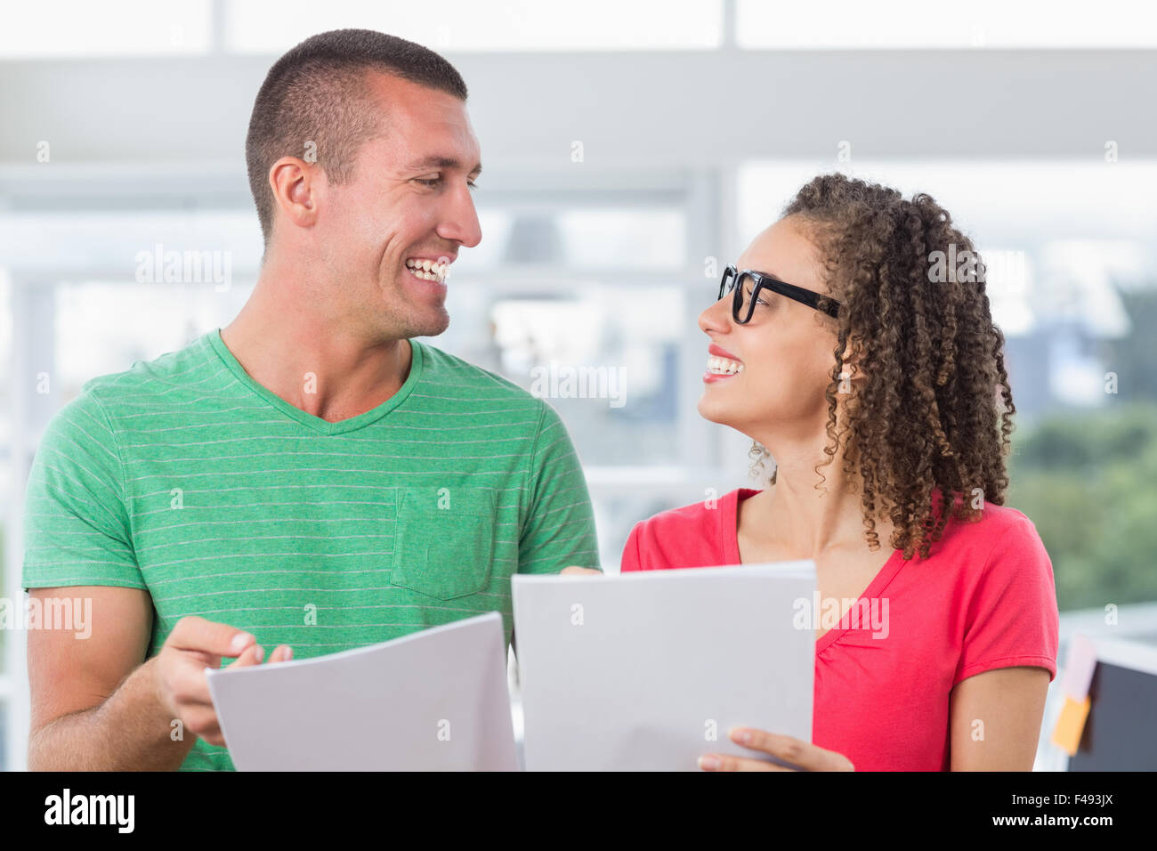 Partner Work Reading Partners working and reading files Stock Photo - Alamy