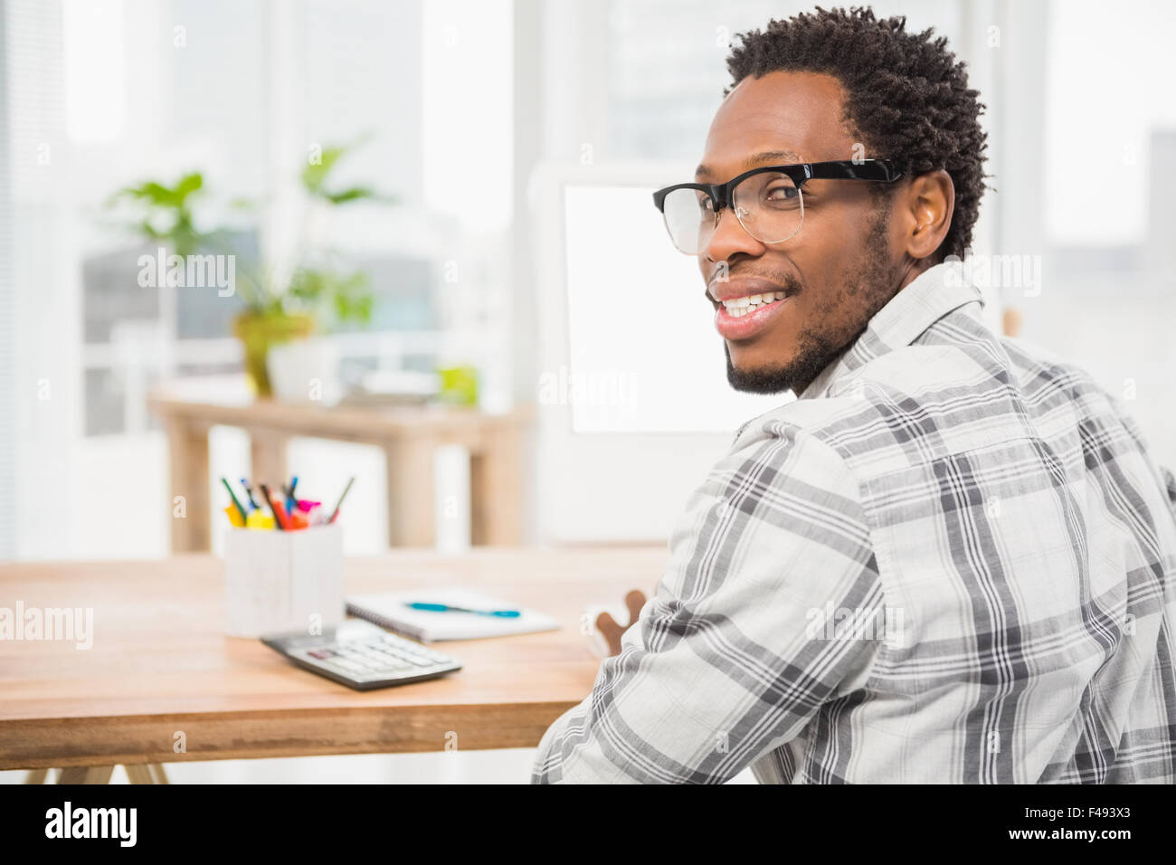 Young businessman smiling at the camera Stock Photo - Alamy