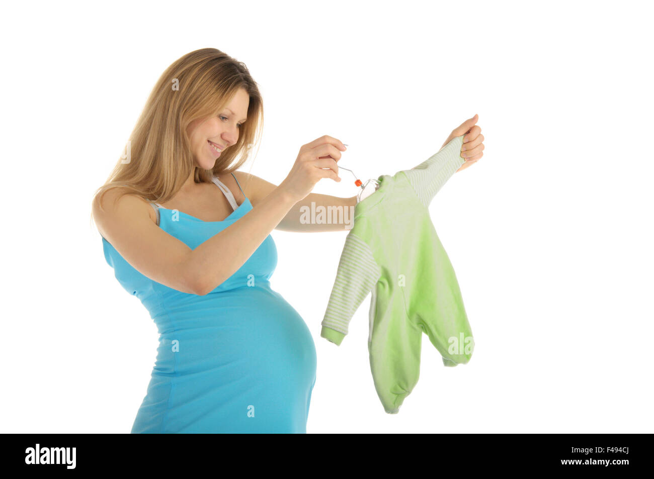 pregnant woman buying baby clothes Stock Photo