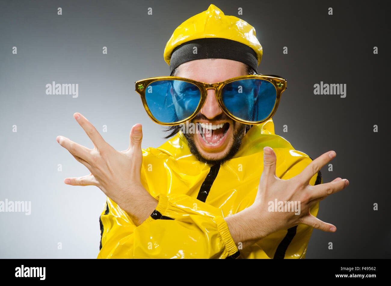 Man wearing yellow suit in funny concept Stock Photo Alamy