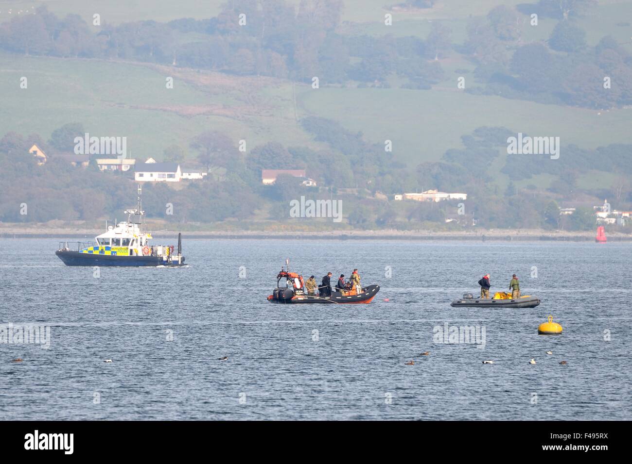 River Clyde, Gourock, Scotland, UK. 15th October 2015. Royal Navy bomb disposal unit detonates wartime mine. The Royal Navy bomb disposal unit towed the world war 2 mine, which was found close to the Gourock shoreline, to safety before divers set an explosive charge to destroy and render the mine safe. Credit:  Douglas Carr/Alamy Live News Stock Photo