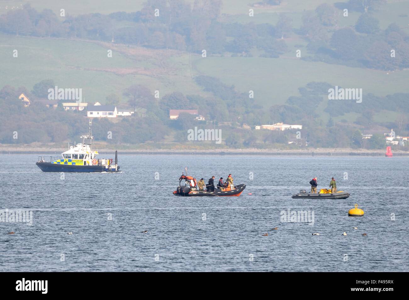 River Clyde, Gourock, Scotland, UK. 15th October 2015. Royal Navy bomb disposal unit detonates wartime mine. The Royal Navy bomb disposal unit towed the world war 2 mine, which was found close to the Gourock shoreline, to safety before divers set an explosive charge to destroy and render the mine safe. Credit:  Douglas Carr/Alamy Live News Stock Photo