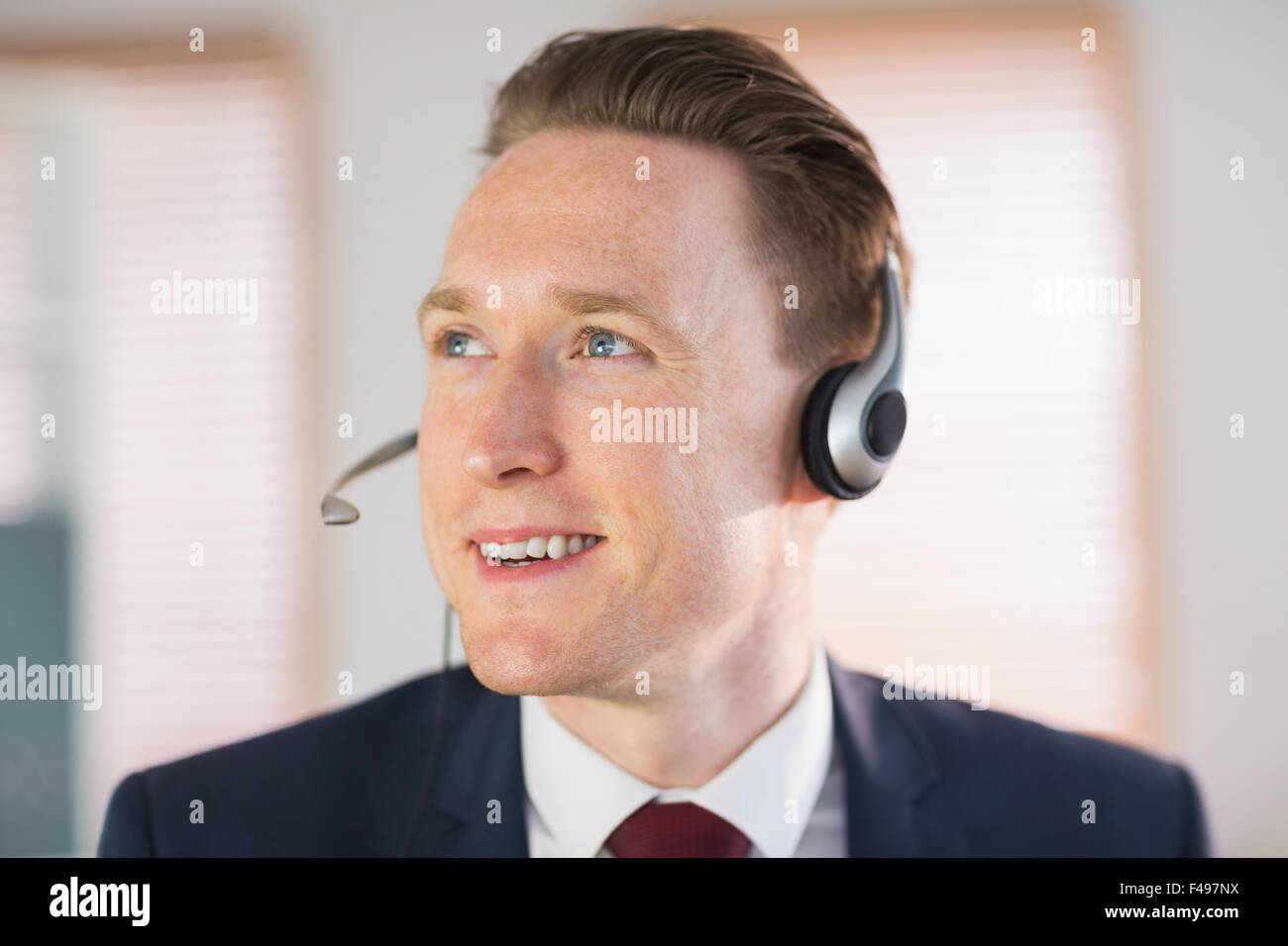 Happy call center agent working Stock Photo - Alamy