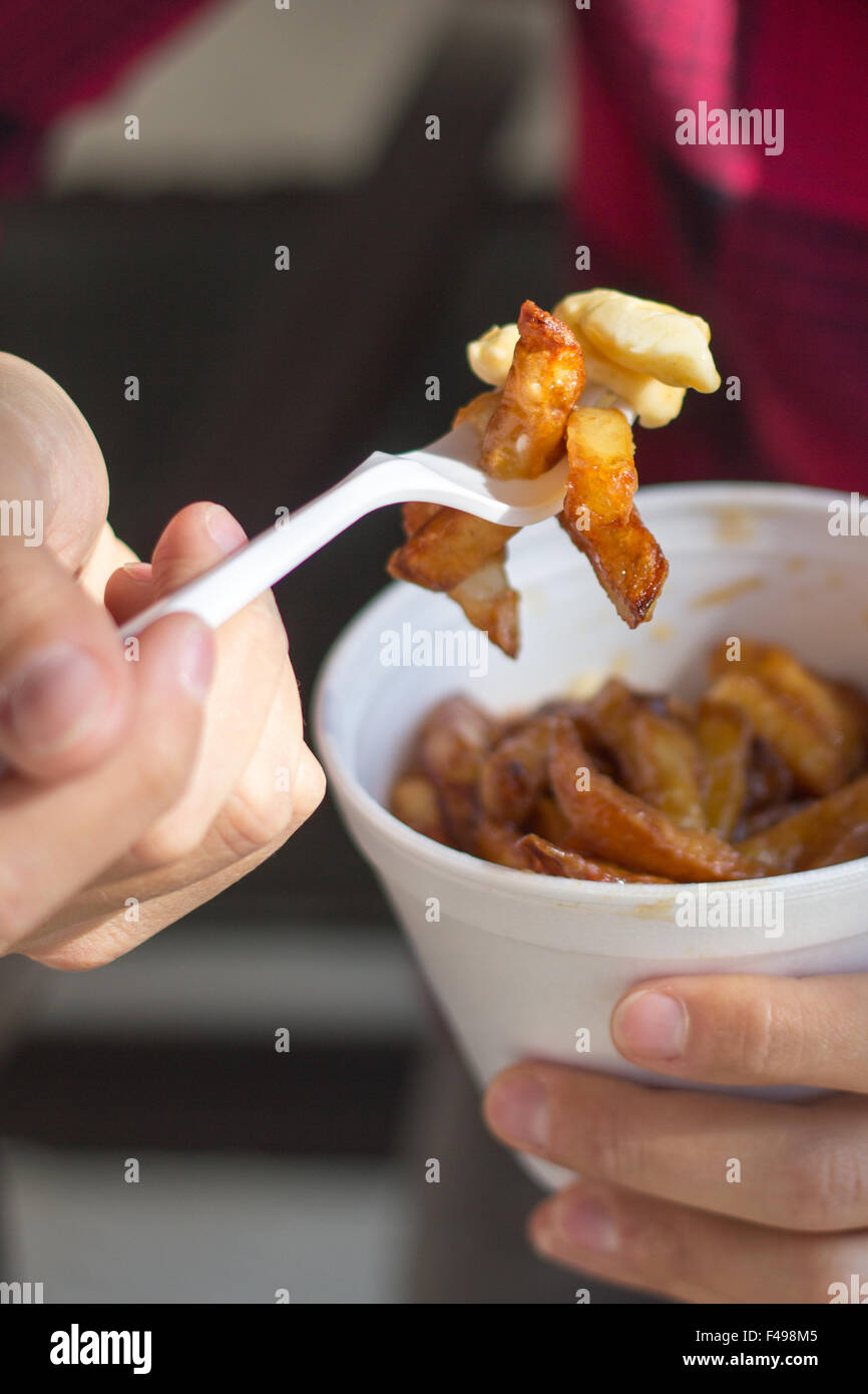poutine bowl closeup poutine is a canadian fast food meal with fries gravy and cheese curd Stock Photo