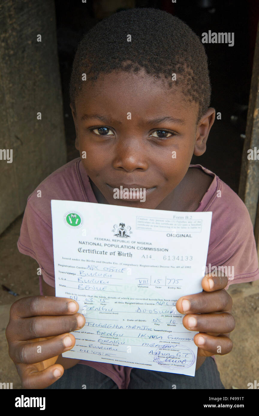 Buruku Local Government Area, Benue, Nigeria. 4th Sep, 2015. September 4, 2015, Buruku, Nigeria - A vulnerable child in the village Tyogbenda, Benue state, displays a legal birth certificate he received after help from Catholic Relief Services' partner agency Caritas Gboko as part of the SMILE program (Sustainable Mechanisms for Improving Livelihoods and Household Empowerment). Birth certificates allow Nigerian youth to one day work and travel freely in and out of the country. © David Snyder/ZUMA Wire/Alamy Live News Stock Photo