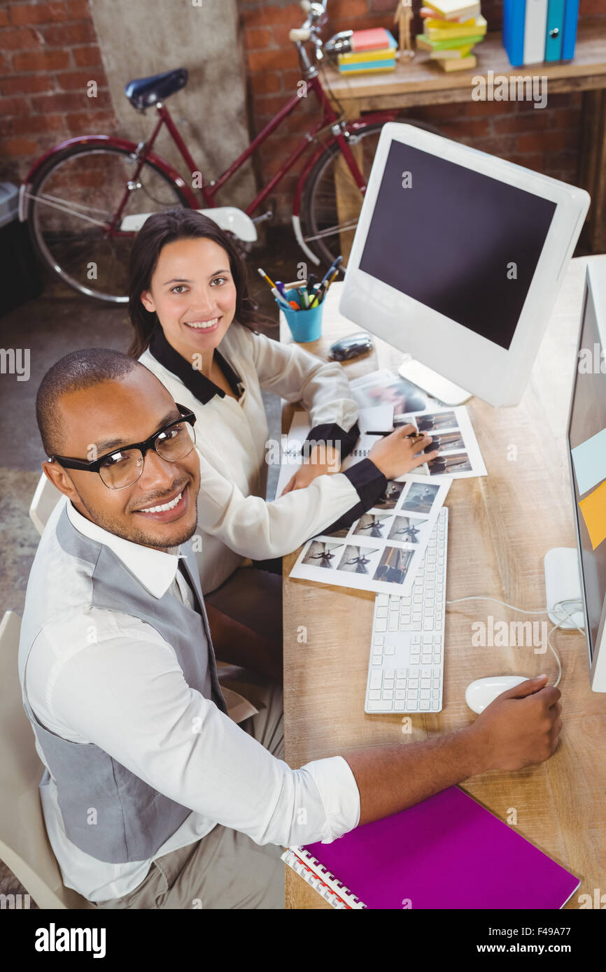 Portrait of smiling man and woman at office Stock Photo - Alamy