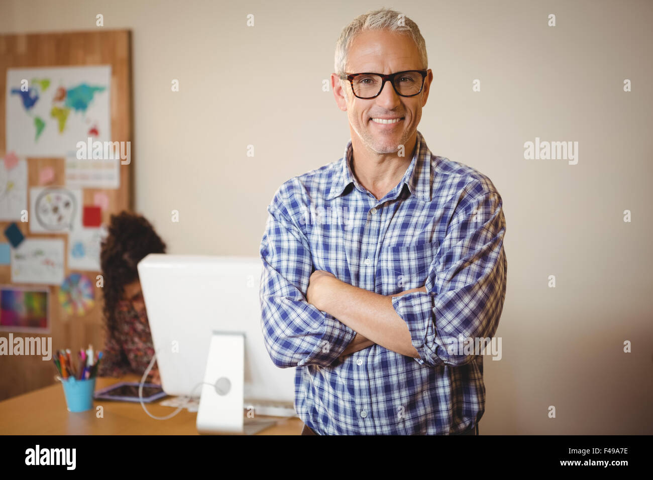 Portrait of happy businessman with arms crossed Stock Photo - Alamy