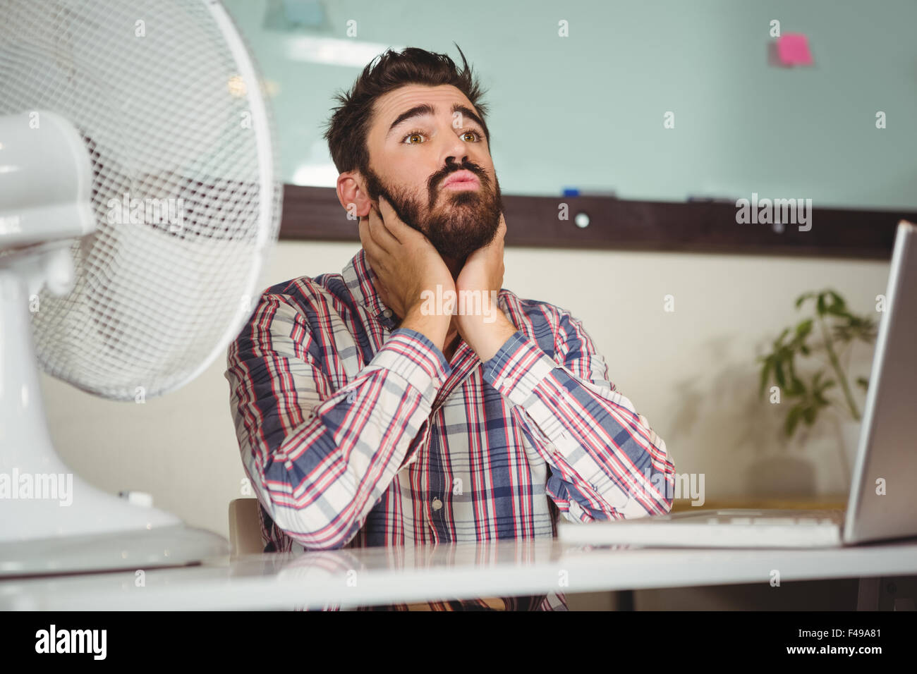 Businessman suffering from neck pain Stock Photo