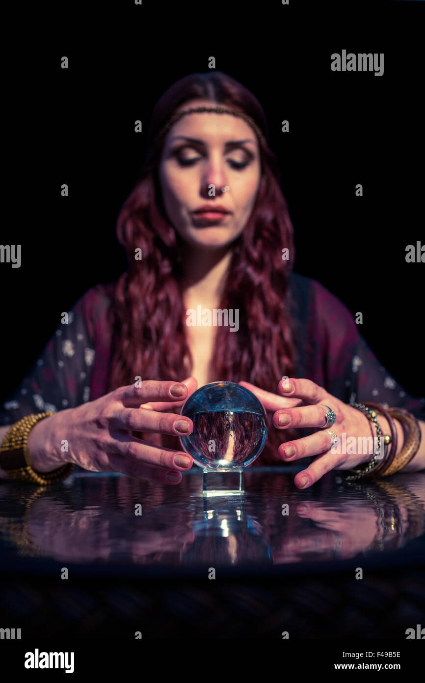 Fortune teller forecasting future with crystal ball Stock Photo Alamy