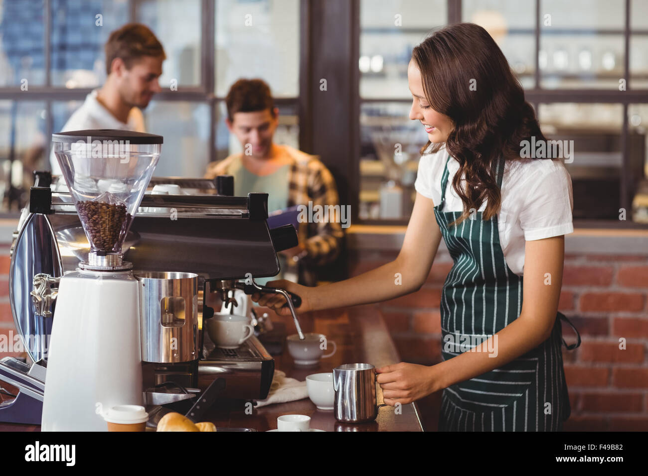 Pretty Barista Making A Cup Of Coffee Stock Photo Alamy