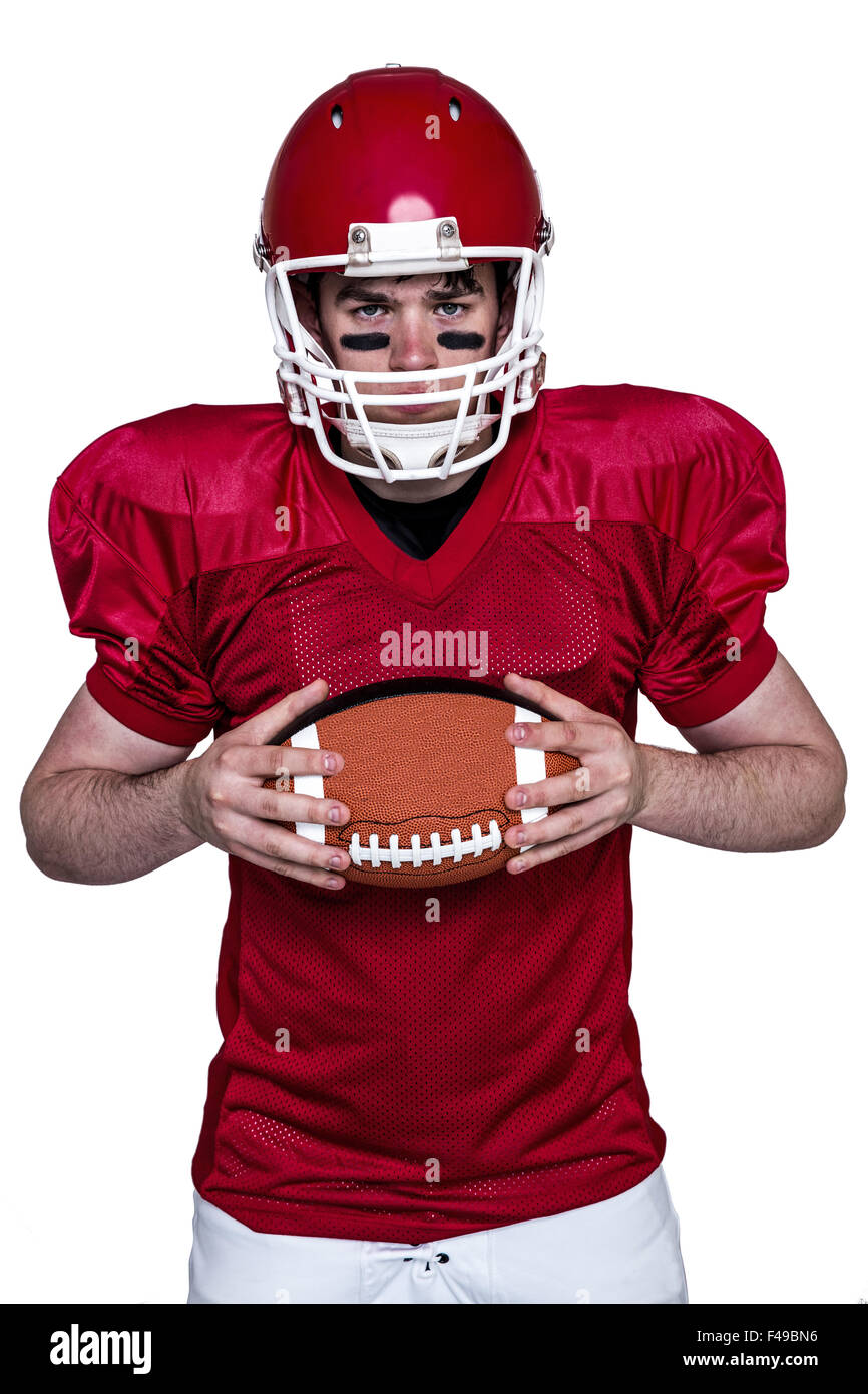 American football player holding a ball Stock Photo - Alamy