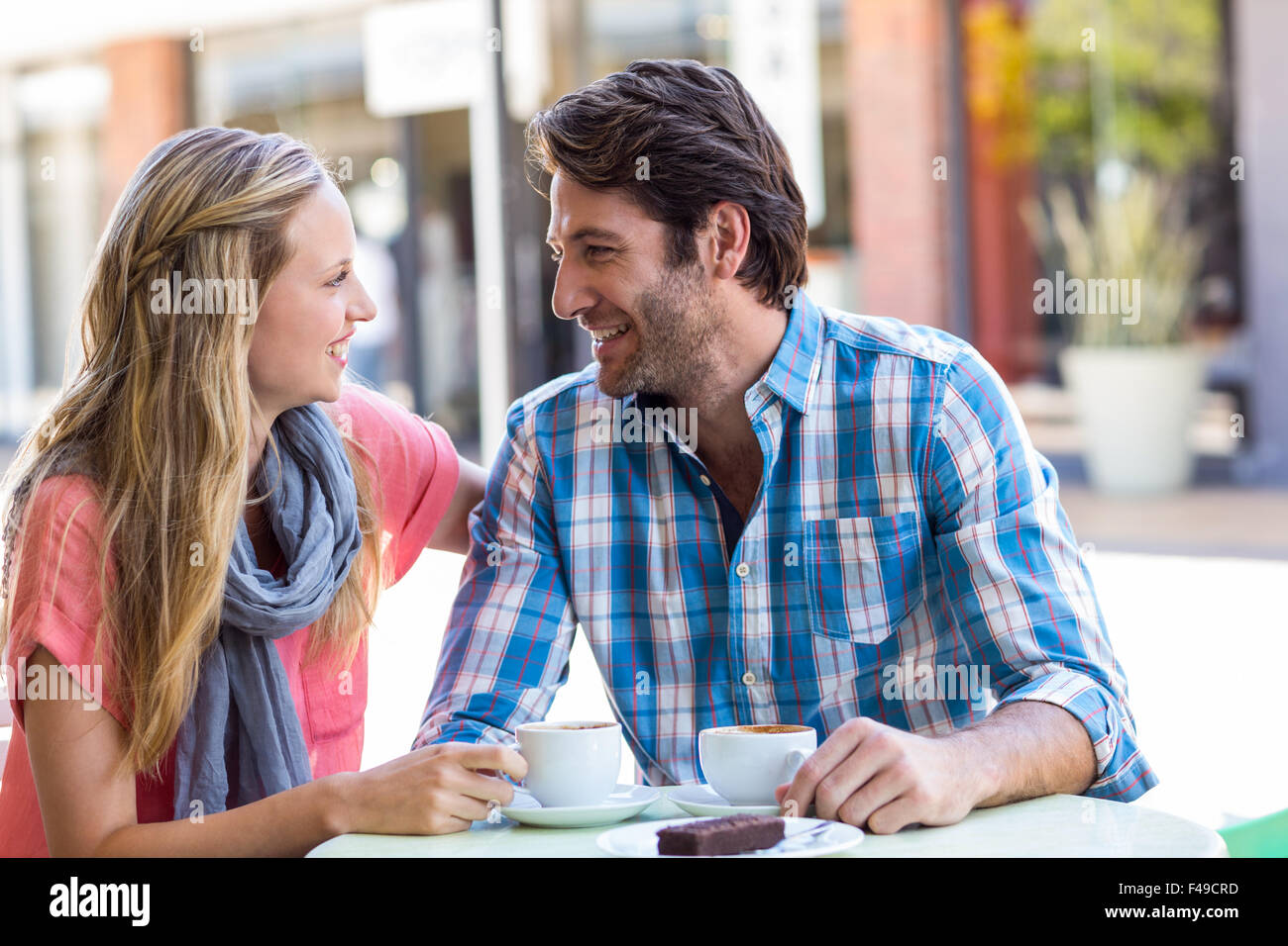 Young happy couple smiling at each other Stock Photo - Alamy