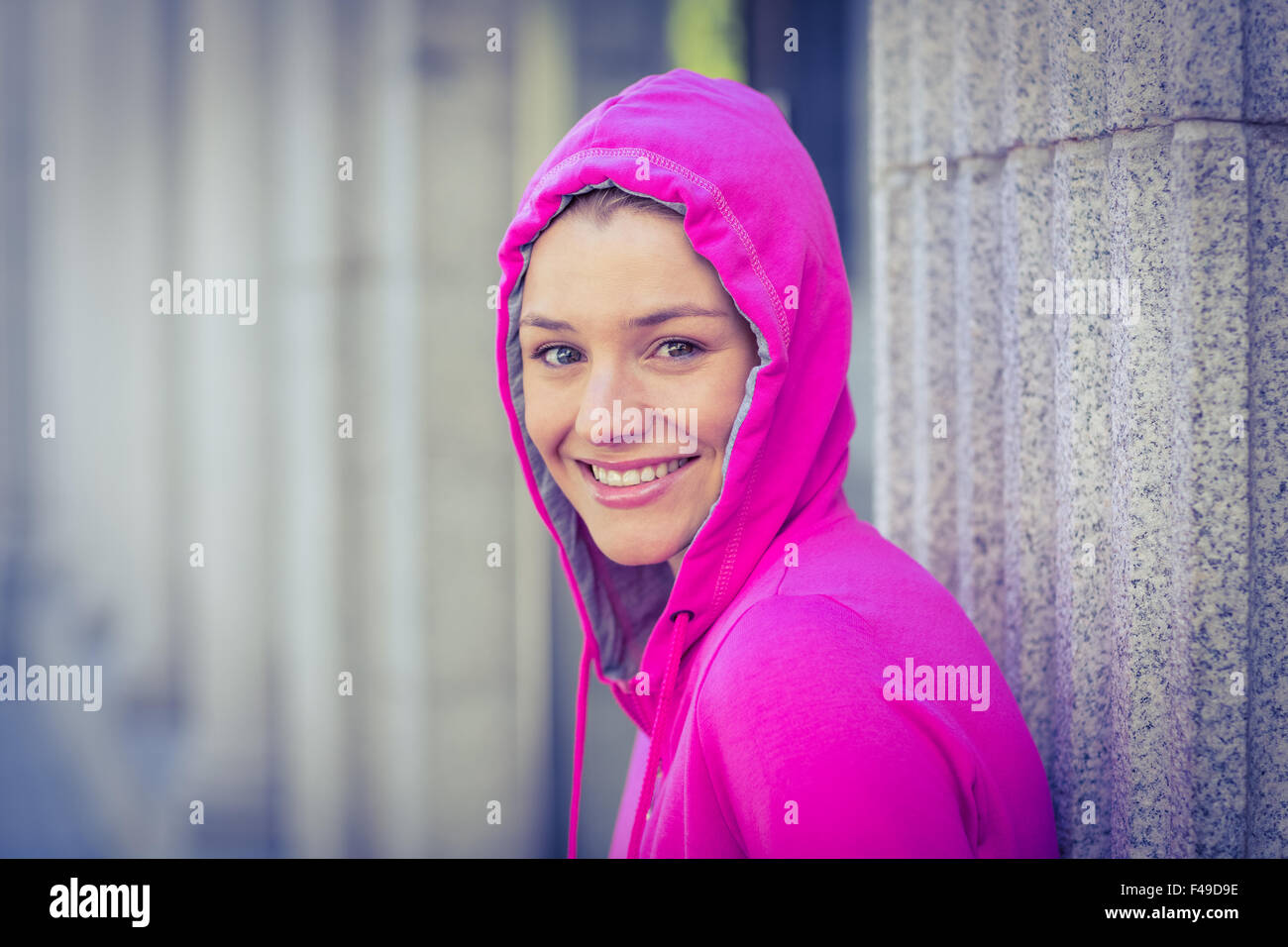 A woman wearing a pink jacket Stock Photo Alamy