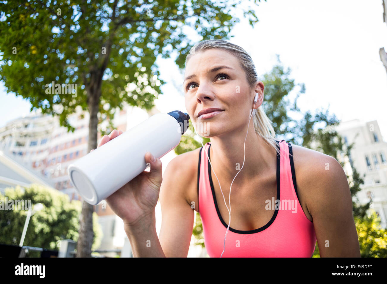 A beautiful woman holding a bottle of water Stock Photo - Alamy
