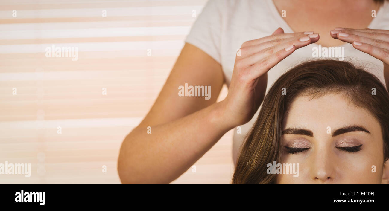 Young woman having a reiki treatment Stock Photo - Alamy