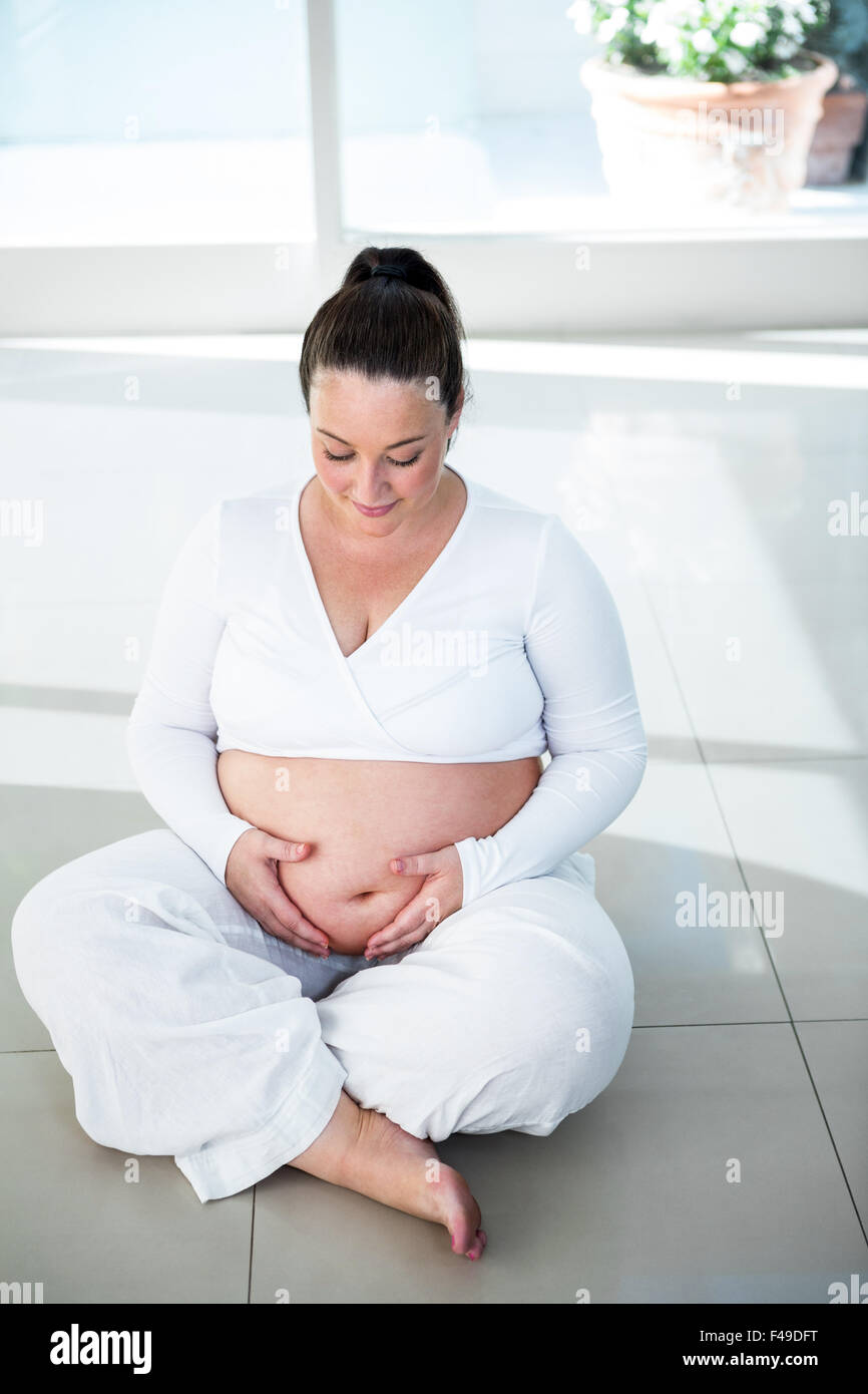 Portrait of pregnant woman sitting on the floor Stock Photo Alamy