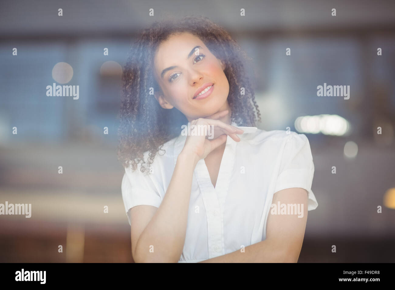 Woman folded arms curly hair hi-res stock photography and images - Alamy