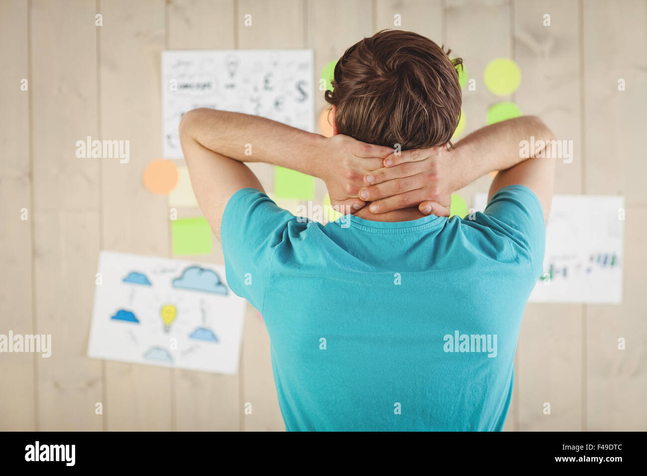 Casual worker looking at brainstorm wall Stock Photo