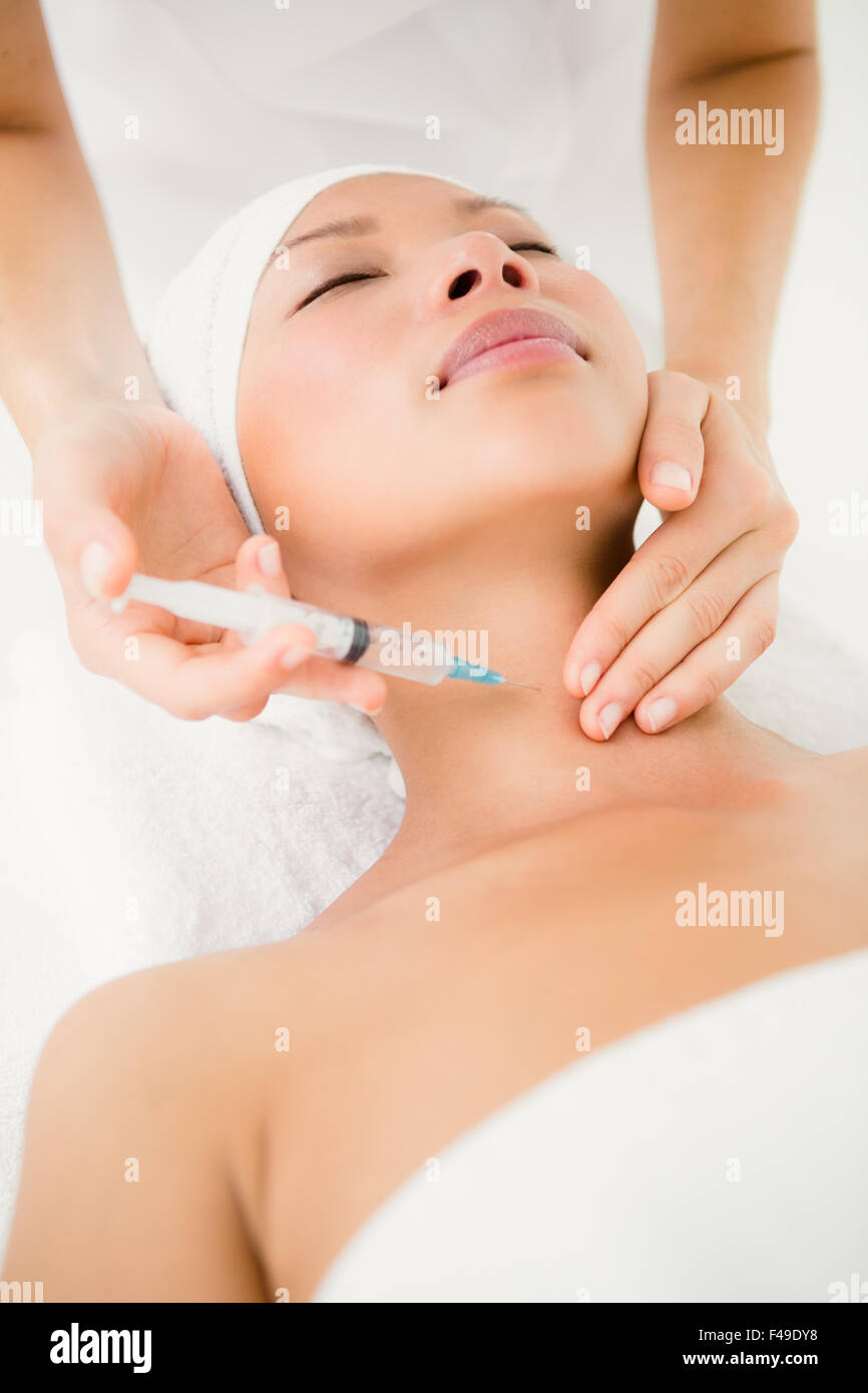 Neck Injection Positioning Doctor giving neck injection to a patient Stock Photo - Alamy