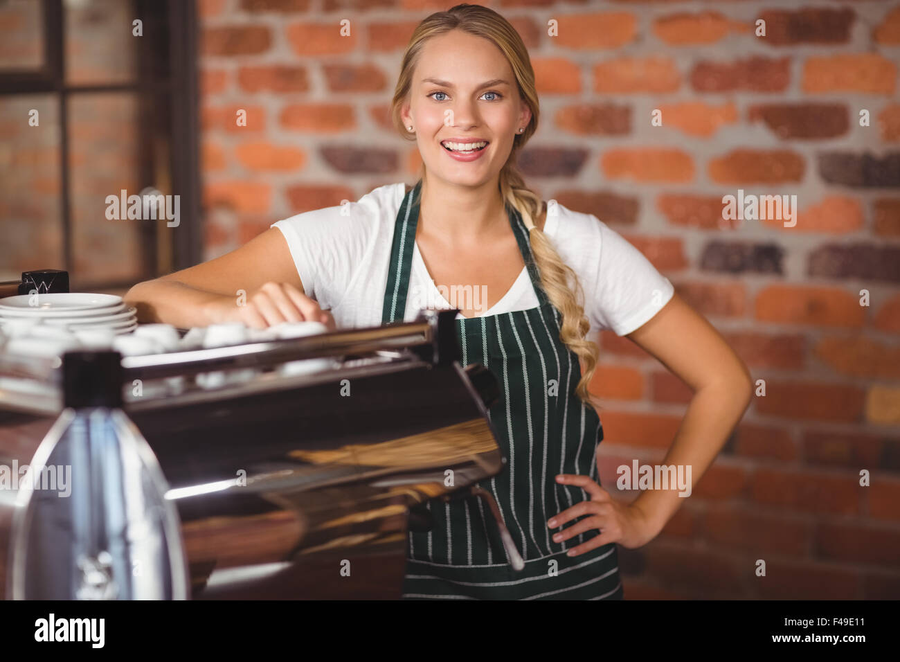 Pretty barista looking at the camera Stock Photo