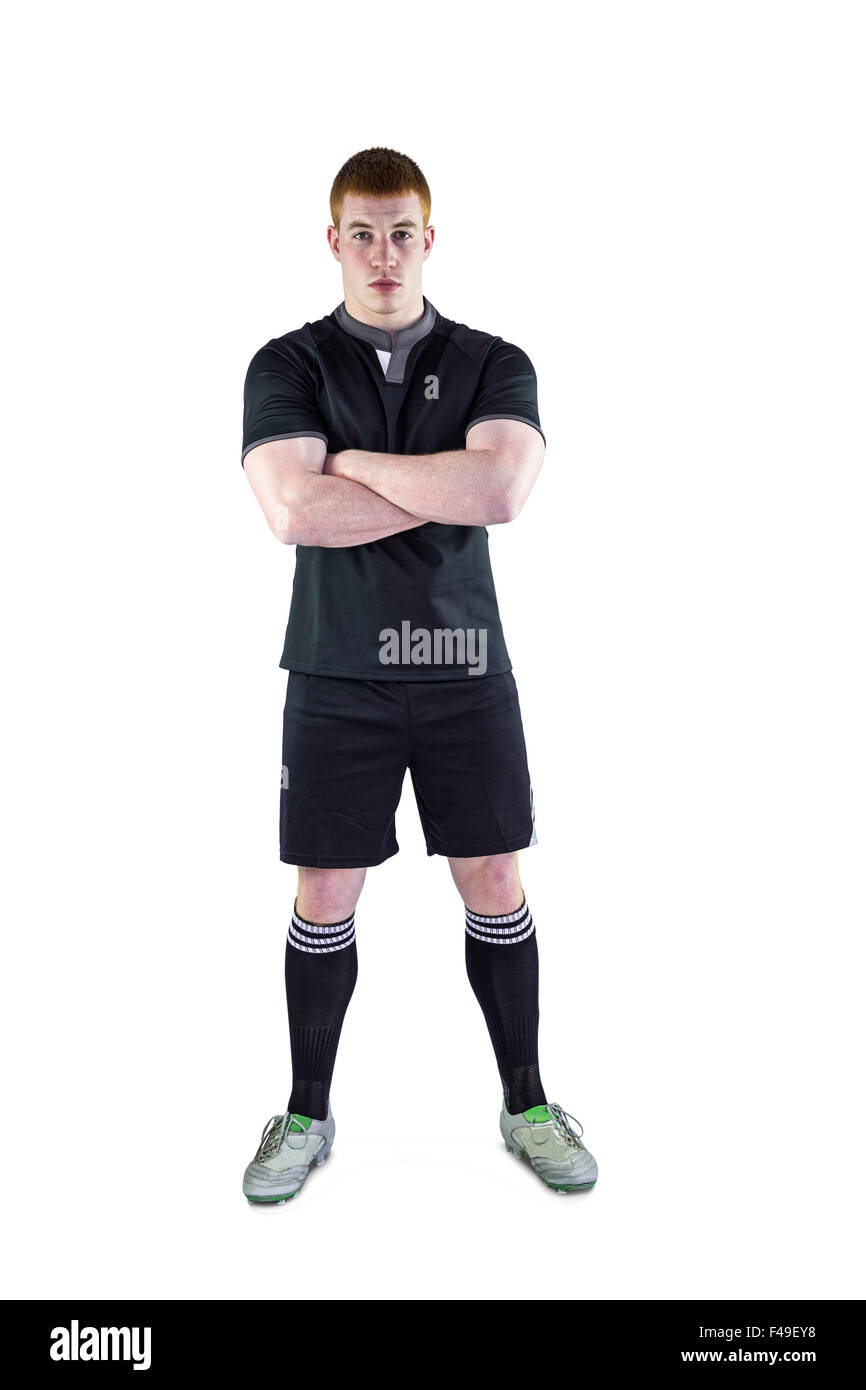 Rugby player with arms crossed Stock Photo