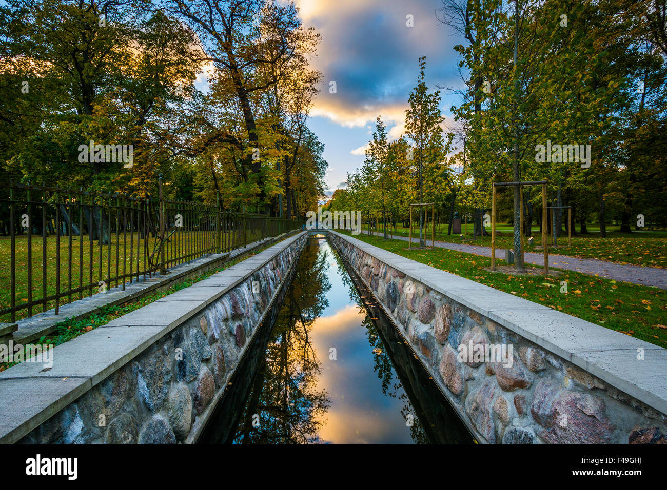 A colorful sunset reflecting in a canal at Kadrioru Park, in Tallinn, Estonia. Stock Photo