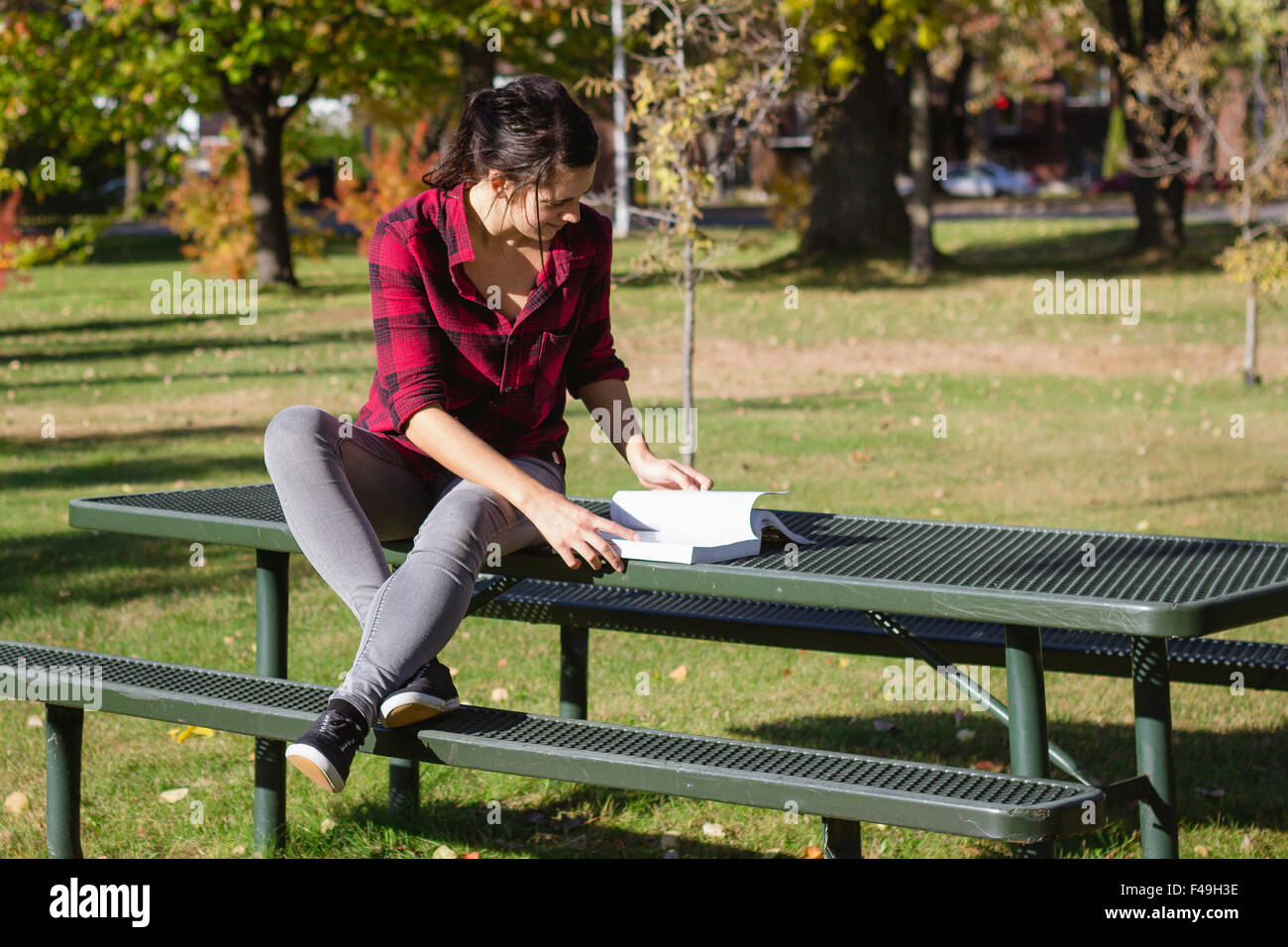 Women studying school book outdoor at fall at daytime Stock Photo