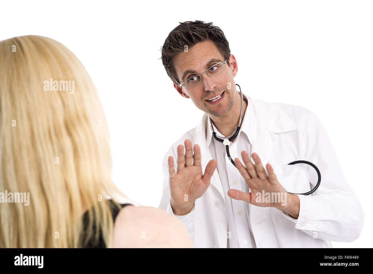 Doctor talking to a blonde woman Stock Photo