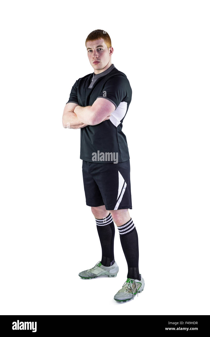 Rugby player with arms crossed Stock Photo