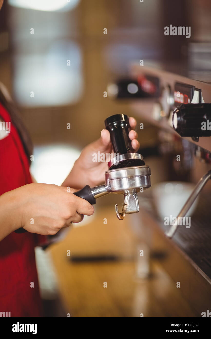 Close up of a barista pressing coffee Stock Photo Alamy