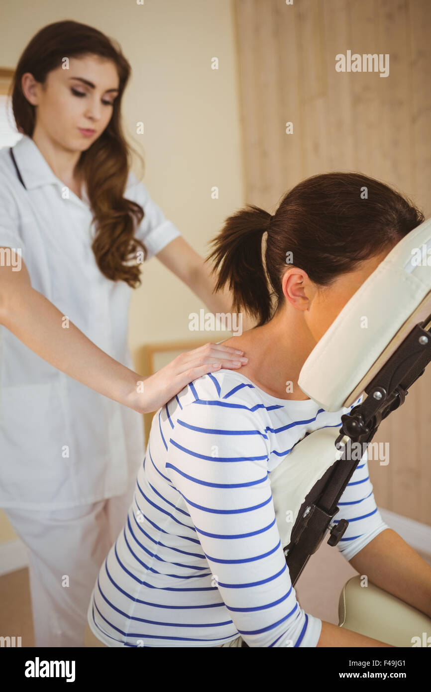 Person Getting Chair Message Young woman getting massage in chair Stock Photo - Alamy