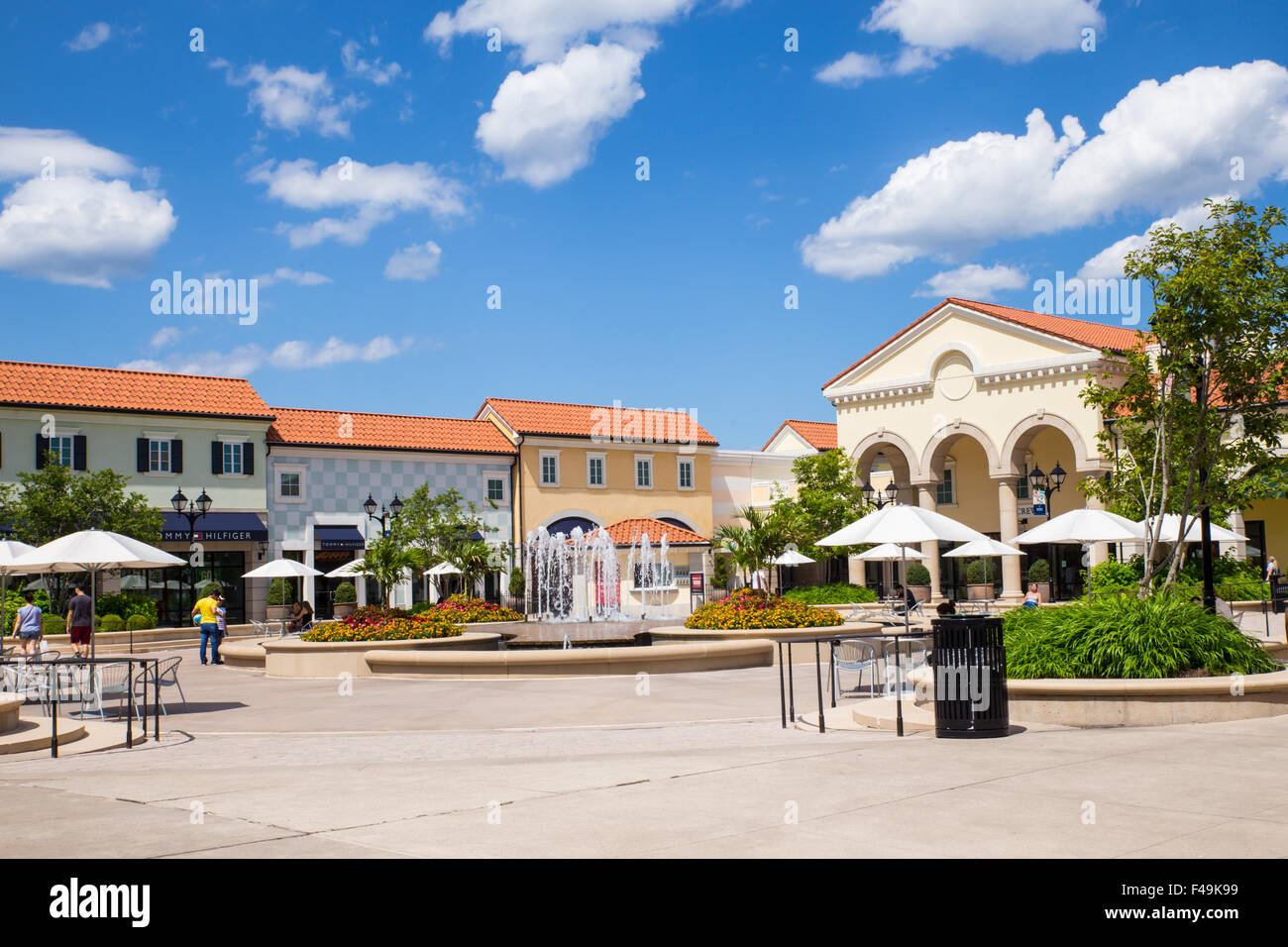 View of Tanger Factory Outlet outdoor shopping mall near the with people visible. Stock Photo