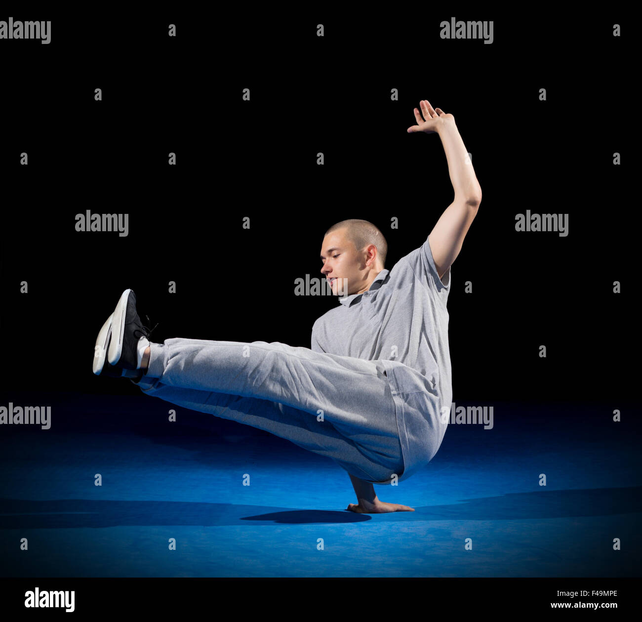 Breakdancer training on dark background Stock Photo