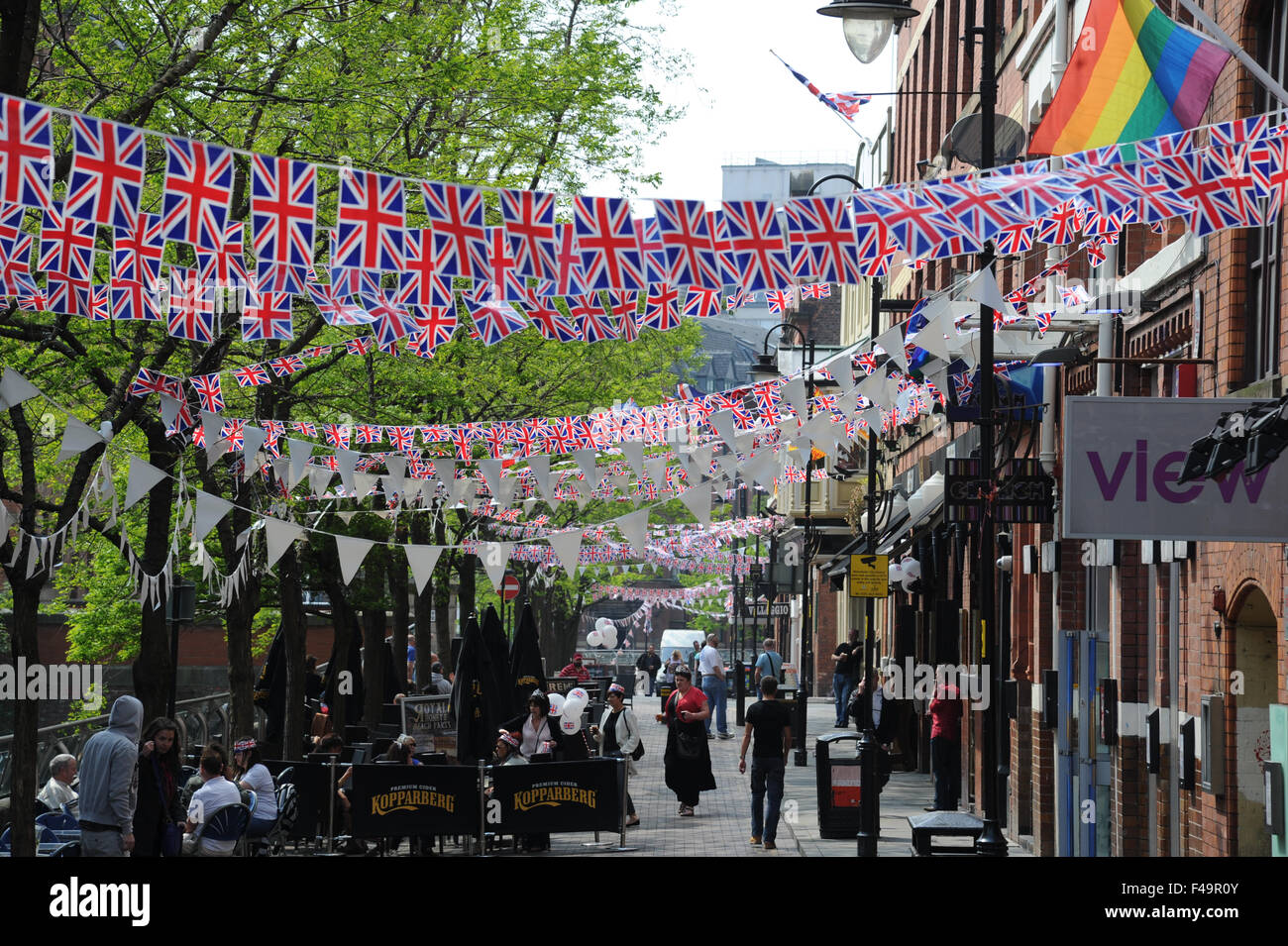 Party bunting on Canal Street in the heart of Manchester's Gay village to celebrate the wedding of William and Kate. Stock Photo