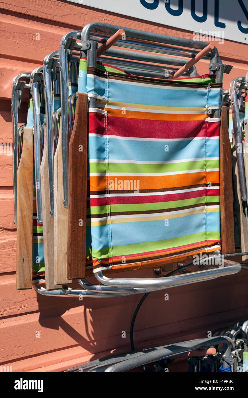 Summer Beach Chairs hanging on wall, Michigan USA Stock Photo