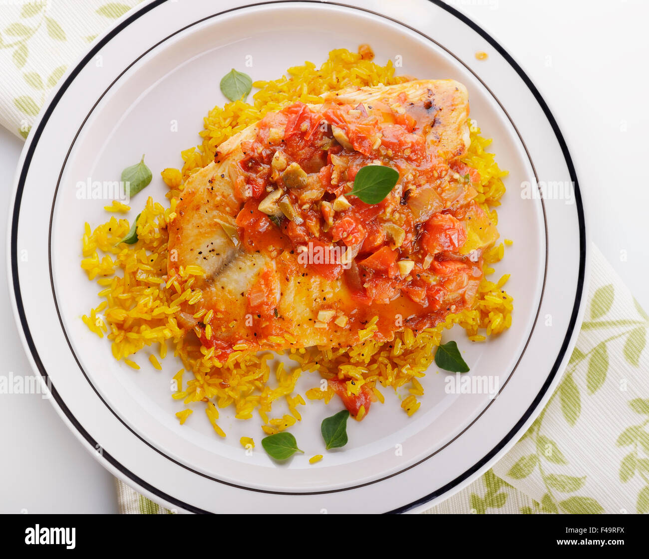 Tilapia Fillets with Yellow Rice and Vegetables Stock Photo Alamy