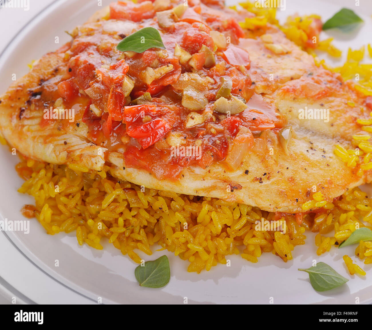 Tilapia Fillets with Yellow Rice and Vegetables Stock Photo Alamy