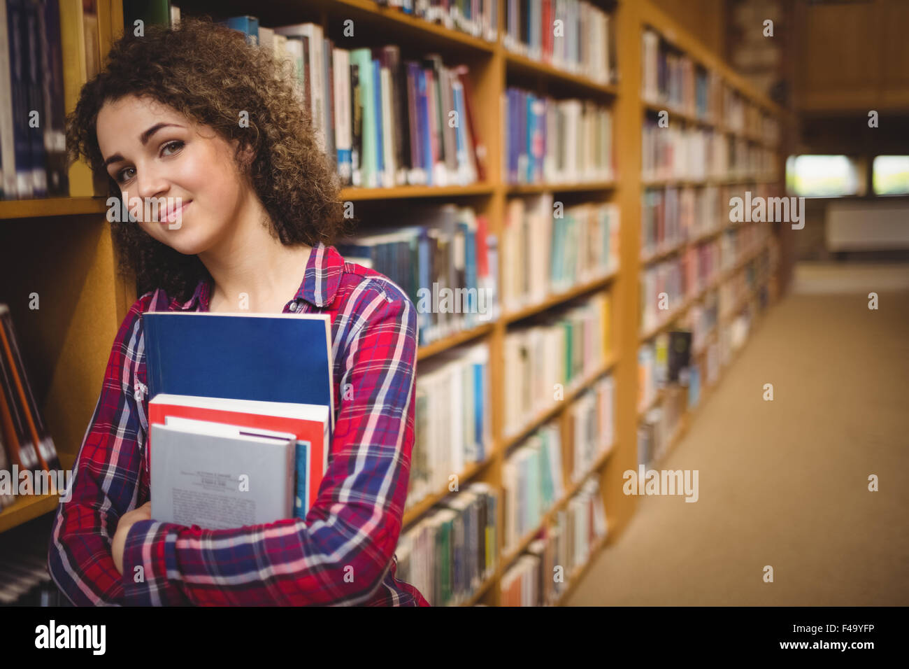 Pretty student in the library Stock Photo - Alamy